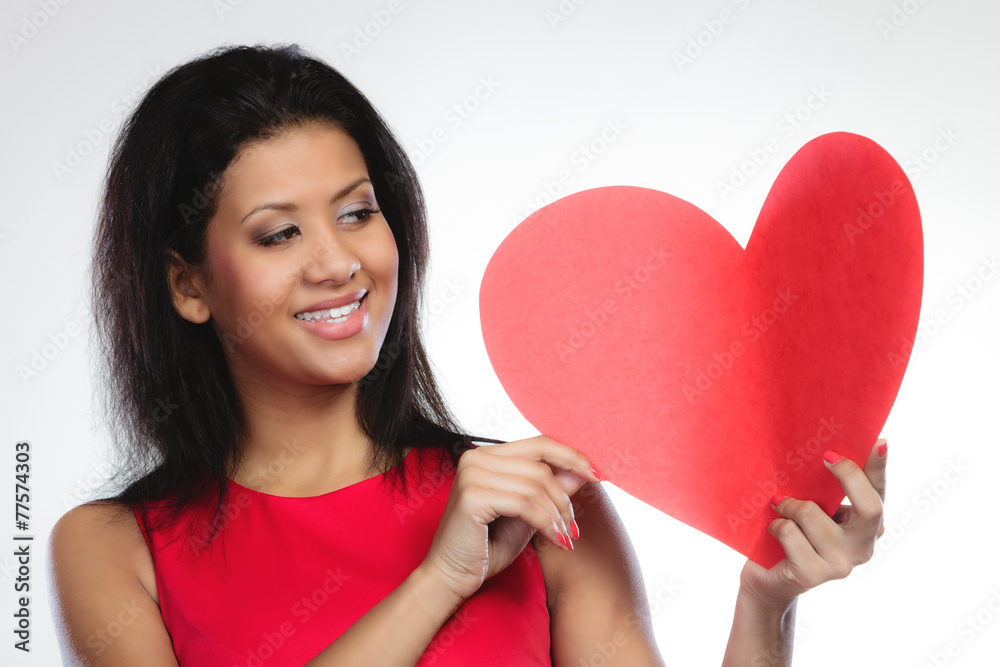 Girl mixed race with paper red heart Girl mixed race with paper red heart