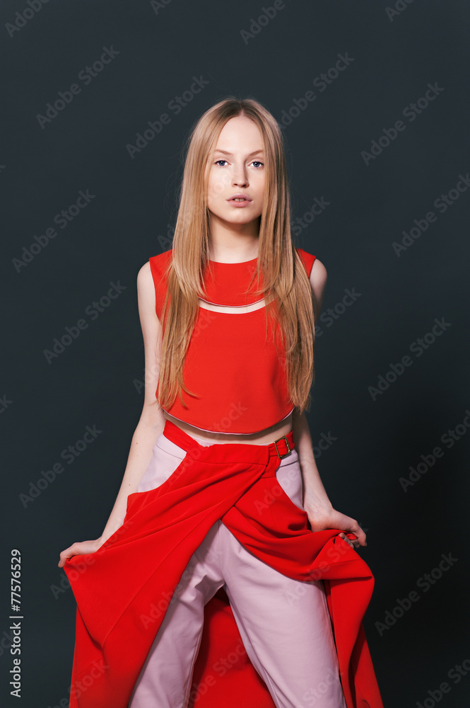 Fototapeta premium Fashion model pose on light background