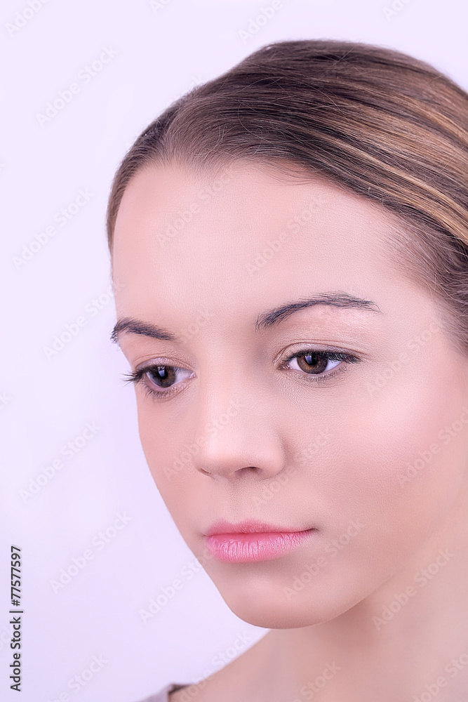 Fototapeta premium Applying makeup on female face, on white background