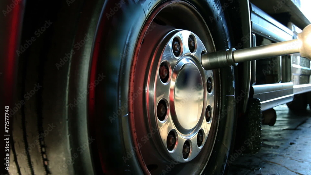 Close up shot of a truck tyre that is beig replaced Close up shot of a truck tyre that is beig replaced