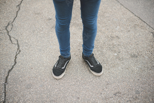 close up of legs and shoes of young man