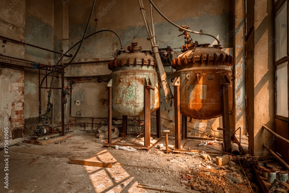 Industrial containers in abandoned interior