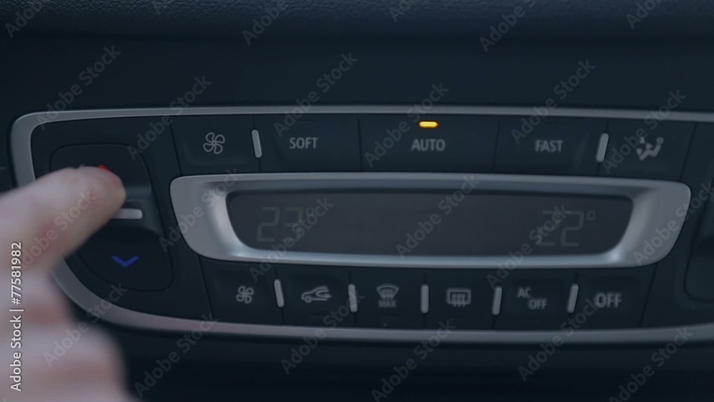 Man changing radio channel on the car radio Man changing radio channel on the car radio
