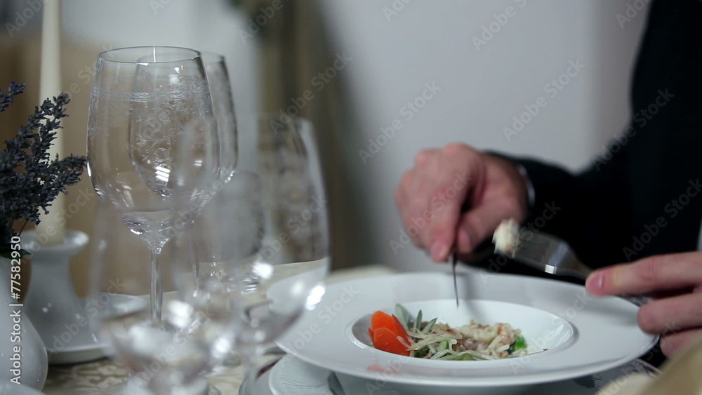 man having lunch from beautifull plate settings man having lunch from beautifull plate settings