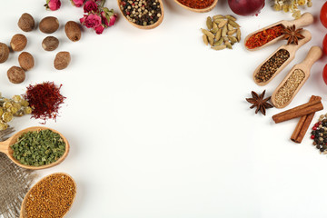 Fototapete Gewürze Different spices and herbs in wooden spoons isolated on white  © Africa Studio