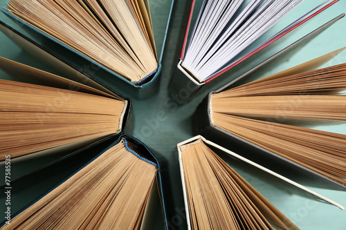Group of books on colorful background, top view