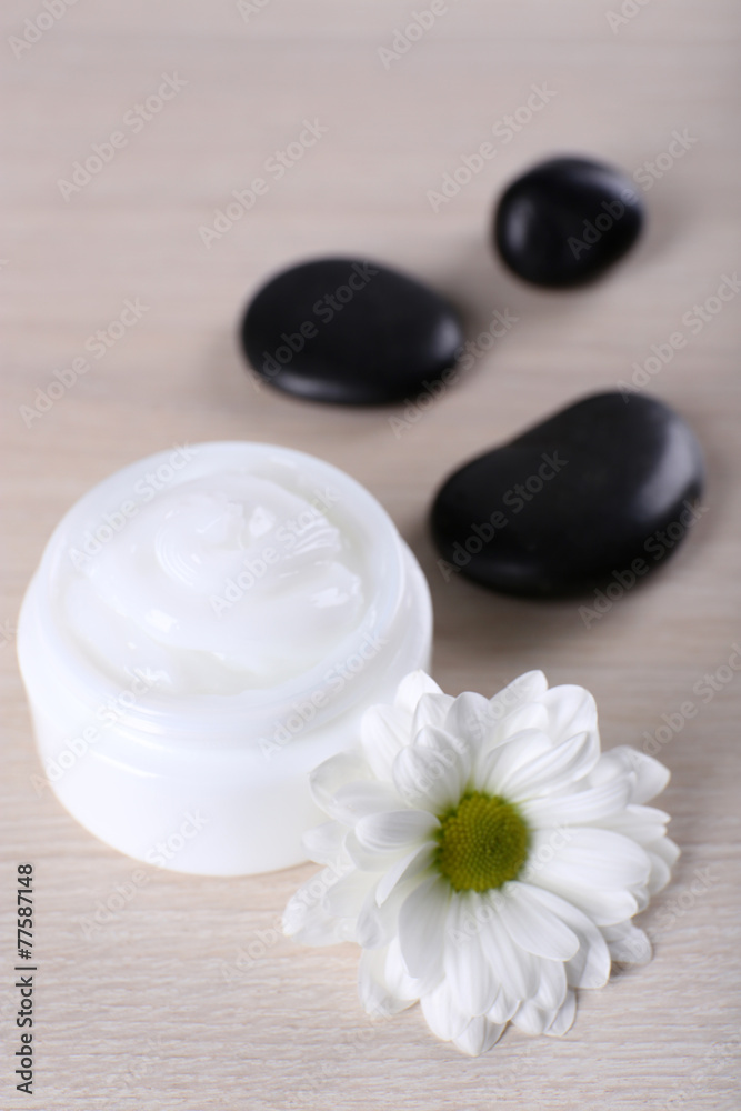 Cosmetic cream with spa stones and chamomile Cosmetic cream with spa stones and chamomile