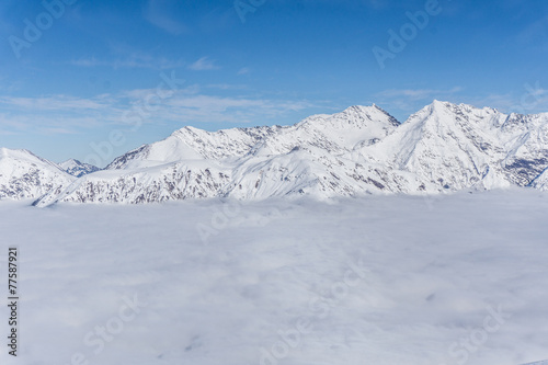 View on mountains and blue sky above clouds © Vasily Merkushev