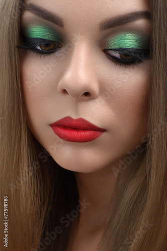 portrait of beautiful girl with bright red lips makeup