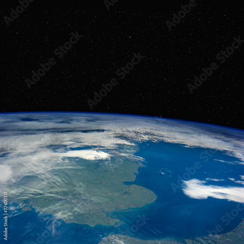 Fototapeta Naklejka Na Ścianę i Meble -  Great Britain from space with stars above.