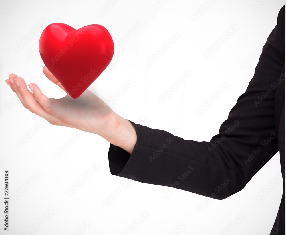 Obraz premium Composite image of businesswomans arm presenting