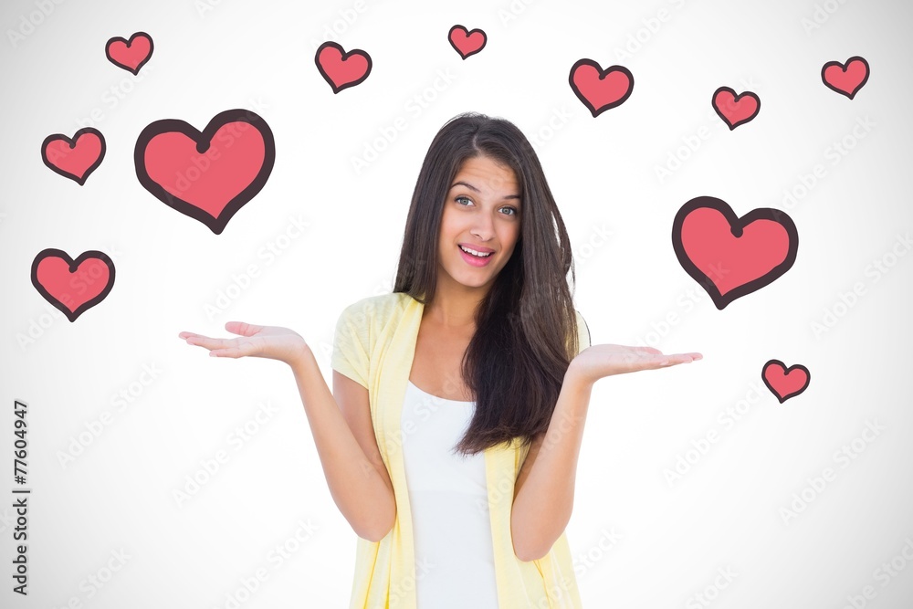 Composite image of happy casual woman shrugging her shoulders Composite image of happy casual woman shrugging her shoulders