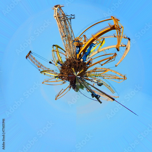 Scrap metal planet with cranes © Juulijs