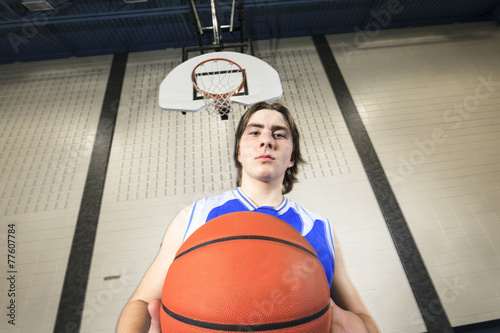 A teenager basketball player play his favorite sport © Louis-Photo
