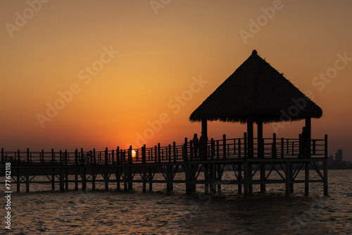 Wooden bridge to the tropical beach in the Thai's island