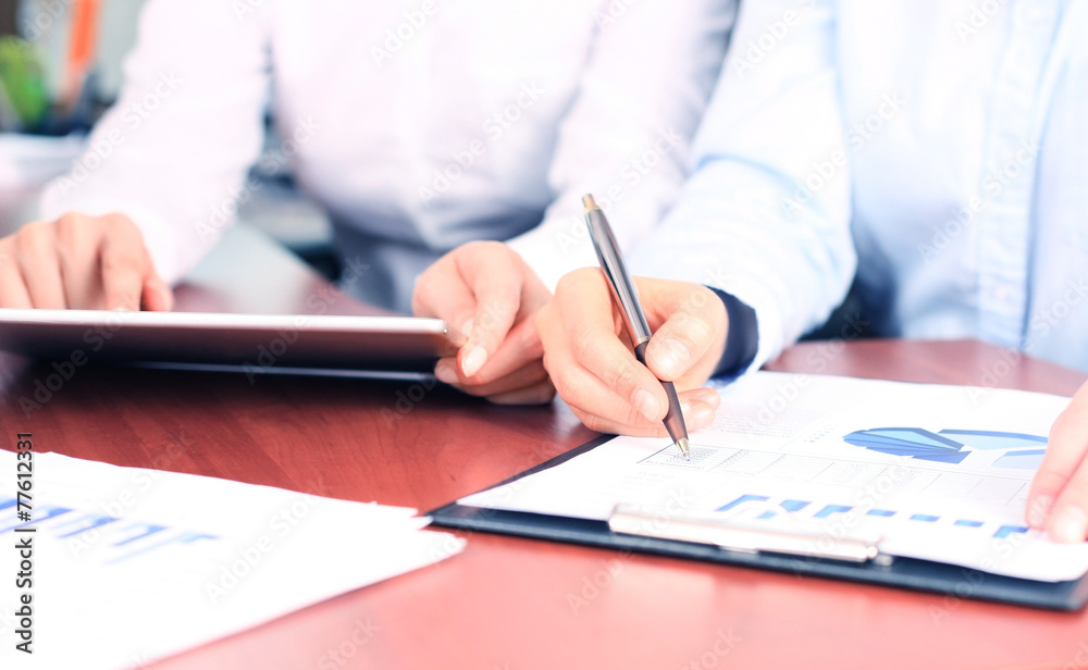 Business adviser analyzing financial figures Business adviser analyzing financial figures