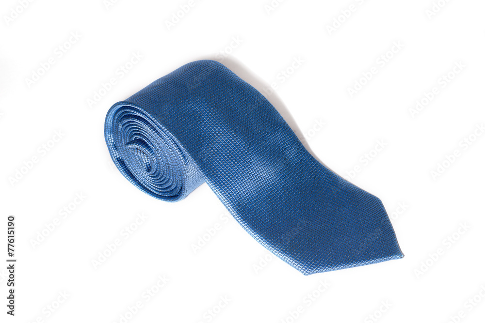 Folded blue tie on a white background Folded blue tie on a white background