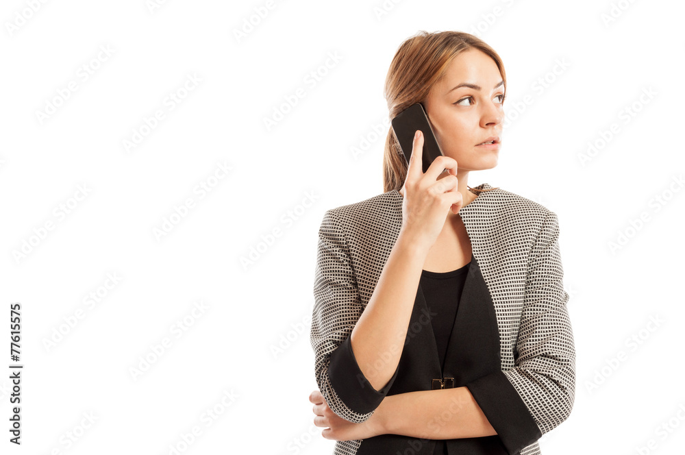 Business woman talking on her smartphone and thinking