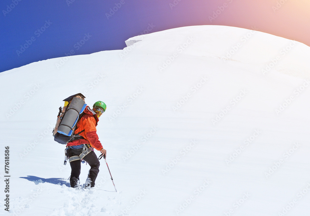 Climber on snowy summit Climber on snowy summit