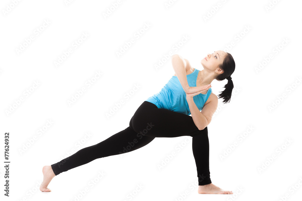 Yogi female in yoga Pose parivritta parshvakonasana Yogi female in yoga Pose parivritta parshvakonasana
