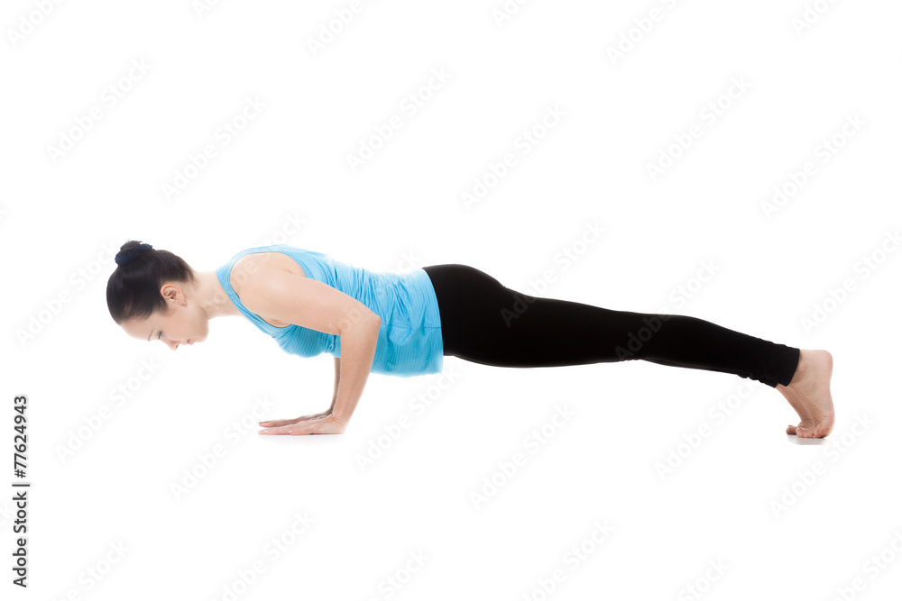 Yogi female in yoga pose Chaturanga Dandasana
