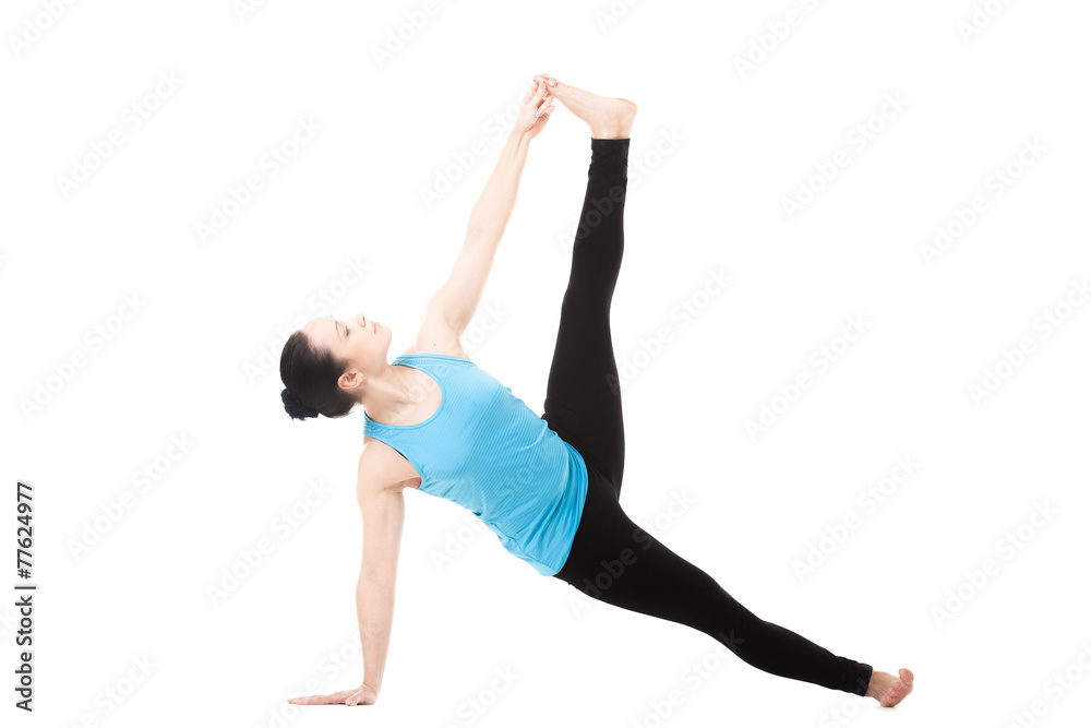 Yogi female in yoga Pose Vasisthasana Yogi female in yoga Pose Vasisthasana