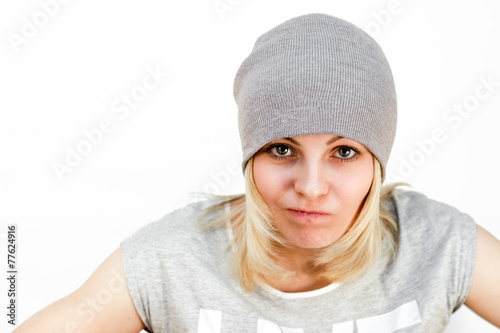 Beautiful girl in hat angry. photo