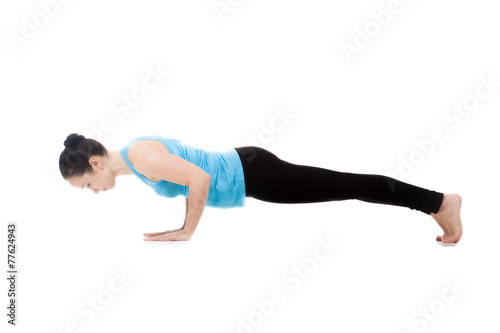 Yogi female in yoga pose Chaturanga Dandasana