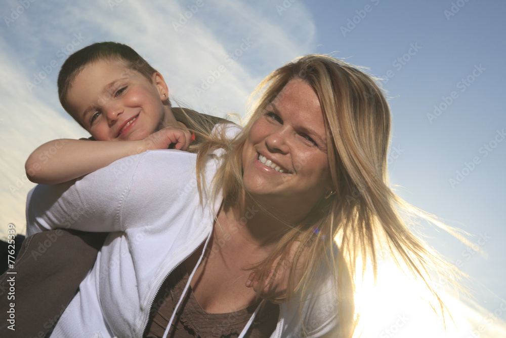 © Louis-Paul Photo - A portrait of a boy with is mother outside