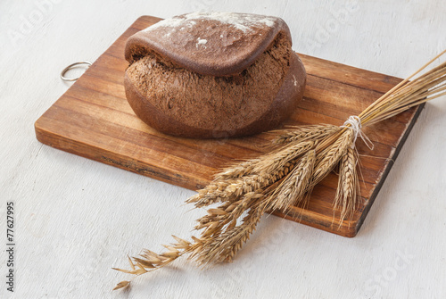 Rye bread Tabatiere on a cutting board photo