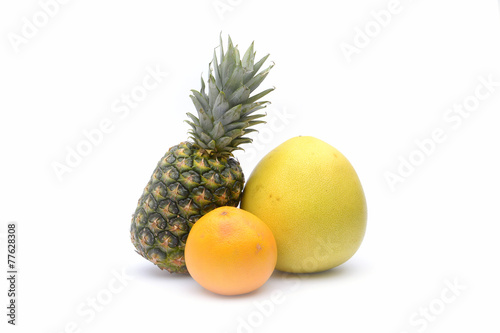 Pineapple, pomelo and grapefruit on white background