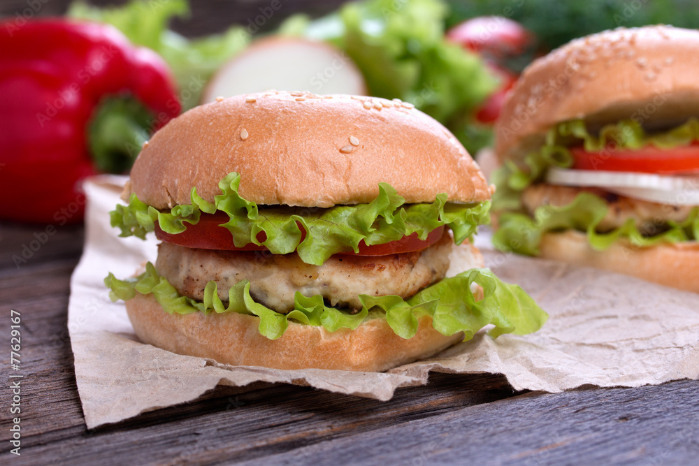 Delicious homemade hamburger on wood Delicious homemade hamburger on wood