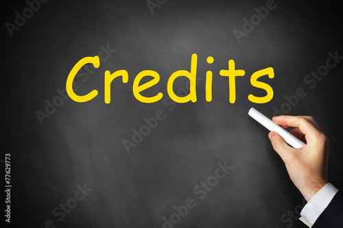 hand writing credits on chalkboard