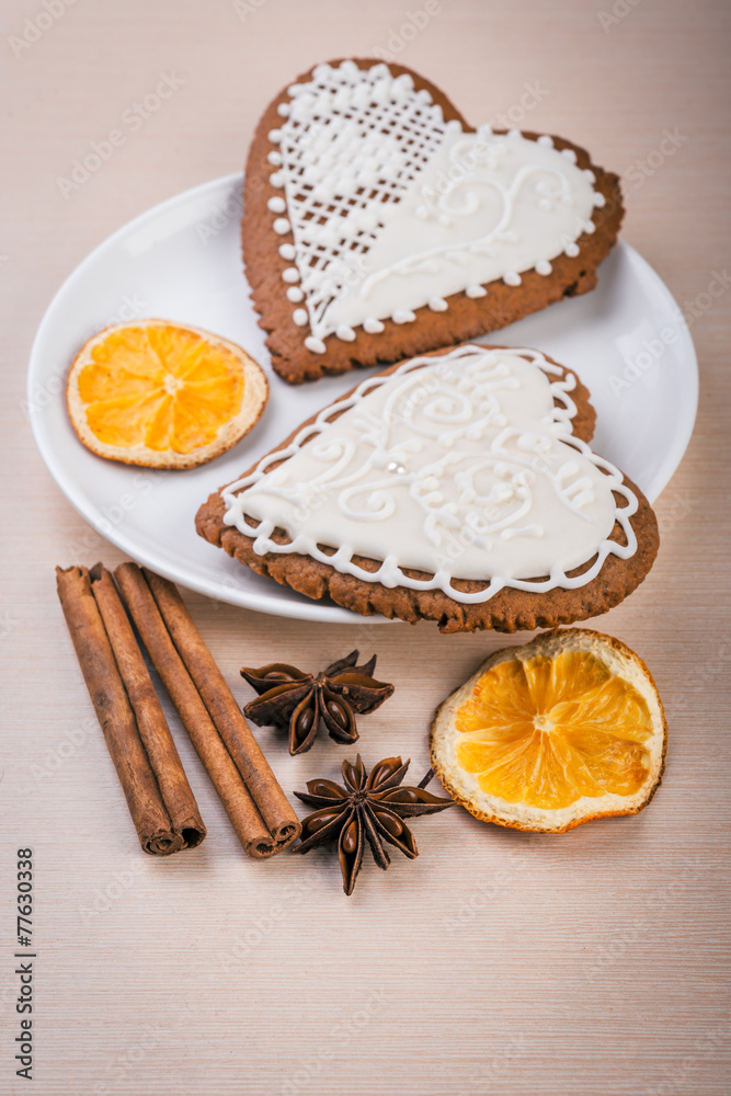 White heart shape gingerbread cookies on  plate