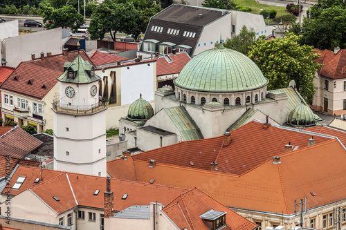 Red tiled roofs and the cathedral city of Trencin in Slovakia photo