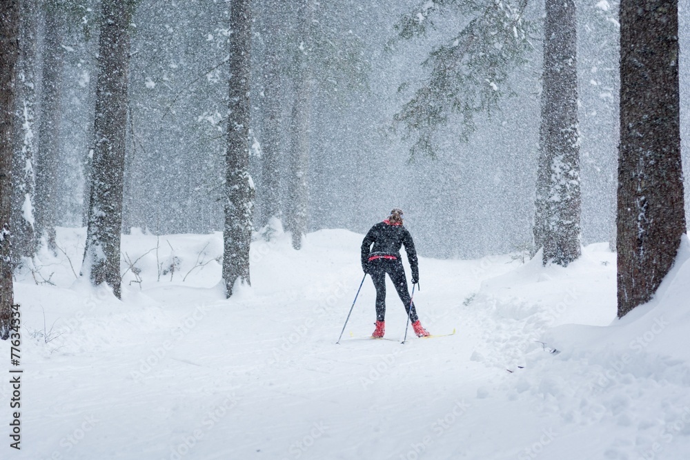 Cross country skiing in bad weather.