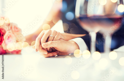 engaged couple with wine glasses