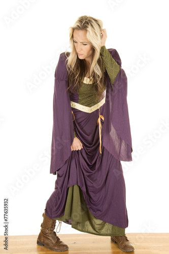woman in a purple dress stand on wood