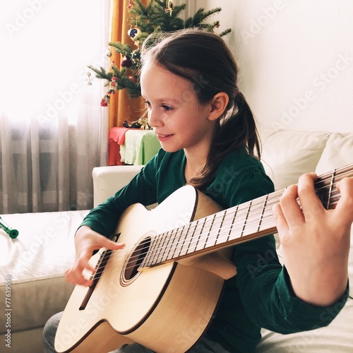 girl playing guitar