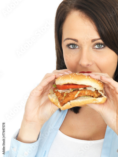 Young Woman Eating a Chicken Burger