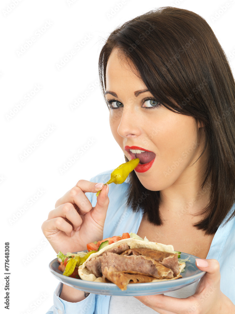 Young Woman Eating Donner Kebab with Salad Young Woman Eating Donner Kebab with Salad