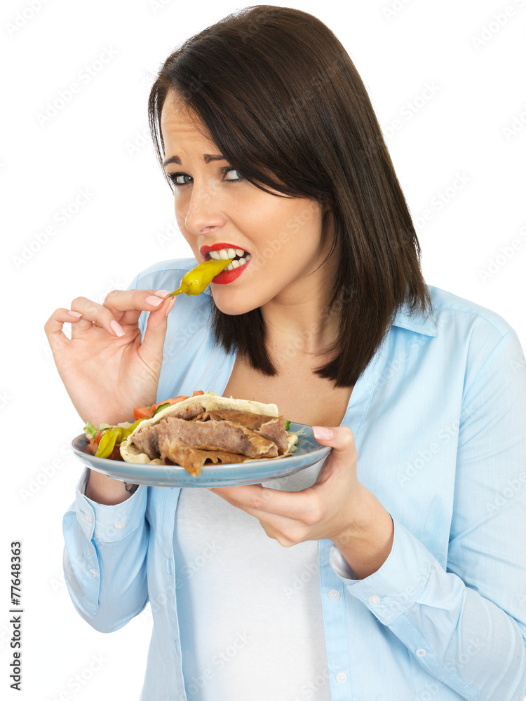 Young Woman Eating Donner Kebab with Salad Young Woman Eating Donner Kebab with Salad
