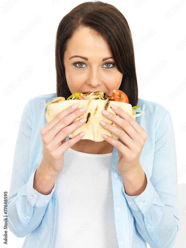 Young Woman Eating Chicken Kebab with Salad Young Woman Eating Chicken Kebab with Salad