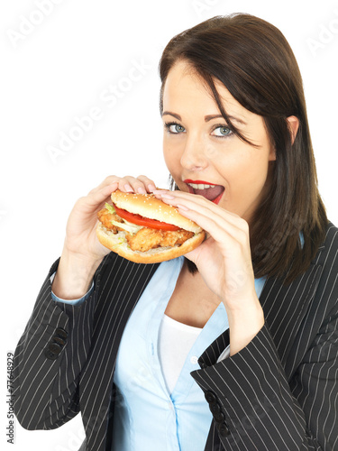 Young Business Woman Eating a Chicken Burger