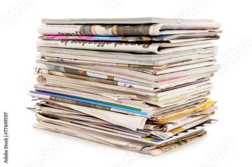 Pile of old newspapers and magazines photo