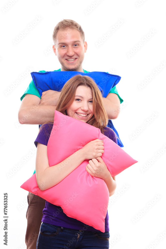 Fototapeta premium Boy and girl holding colorful pillows
