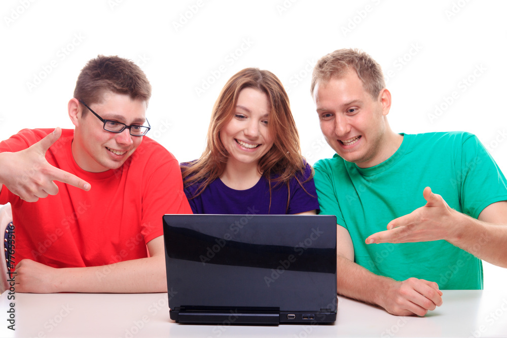 Friends sitting at a computer Friends sitting at a computer