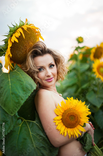 Woman with sunflowers photo