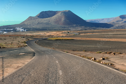 a road on volcanic landscape at  Lanzarote Island  Canary Island