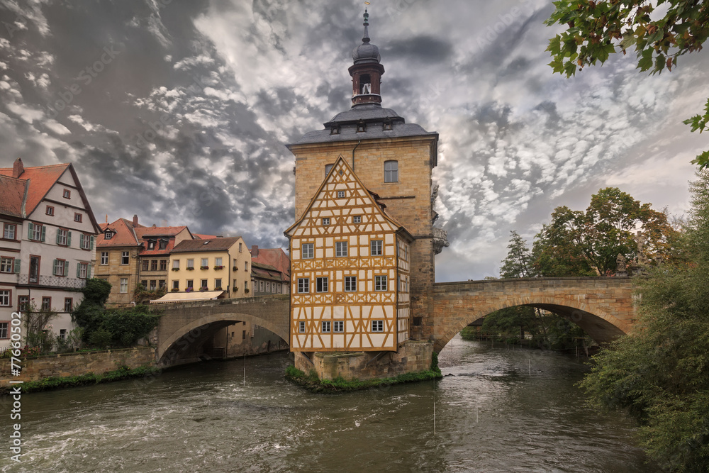 Obere bridge and Altes Rathaus and cloudy sky, sepia